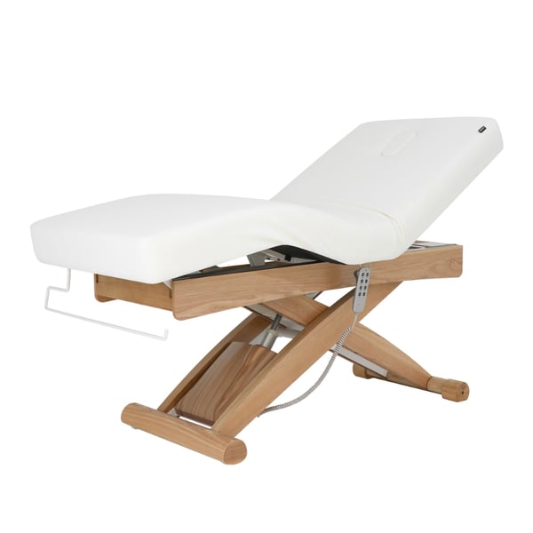 Lettino da massaggio elettrico Cyx+: tre motori, materasso SuperSoft, rivestimento in PU bianco e finitura in legno naturale.