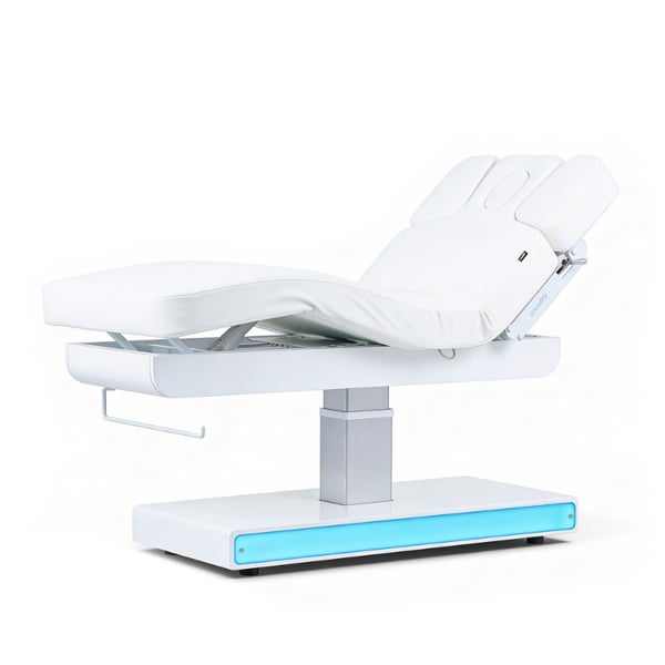 Lettino da massaggio elettrico Nush+: tre motori, LED RGB, materassino SuperSoft e rivestimento in PU bianco.