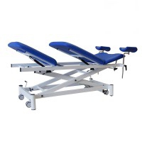 Barella ginecologica elettrica a tre corpi, ideale per specialità mediche, Kinefis Explore: con struttura in profilati di acciaio saldati, ruote retrattili, schienale regolabile, cosciali e foro viso Barella ginecologica elettrica a tre corpi, ideale per specialità mediche, Kinefis Explore: con struttura in profilati di acciaio saldati, ruote retrattili, schienale regolabile, cosciali e foro viso